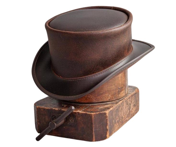 The Marlow Leather Top Hat is handmade in the USA from 100% authentic top-grain cowhide leather. Loved by Harley Davidson, motorcycle and steampunk sub culture enthusiasts, this short crown, coachman style men’s biker top hat is for the man who isn’t afraid to stand out in a crowd. It's available for purchase at our retail shop in Smyrna, TN, just outside of Nashville. We sale these unbanded so you can have a choice of a band or no band. Sizes S,M,L,XL / Brim Measures 2" Crown Measures 4" / Choo Steampunk Leather Brimmed Hat Bands, Vintage Top Hat For Western-themed Events, Vintage Leather Top Hat With Short Brim, Leather Flat Crown Hat For Western-themed Events, Vintage Leather Hat With High Crown, Brown Leather Top Hat For Rodeo, Vintage Leather High Crown Hat, Vintage Leather Hat Bands For Flat Crown, Leather High Crown Top Hat For Rodeo