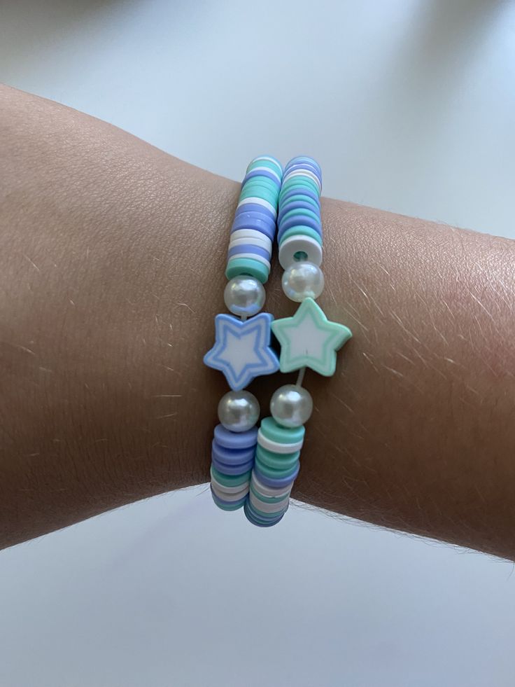 This bracelet is a cute summer friendship bracelet with blue and turquoise stars Trendy Handmade Turquoise Friendship Bracelets, Casual Light Blue Friendship Bracelets, Blue Beaded Star-shaped Bracelets, Playful Adjustable Blue Friendship Bracelets, Blue Beaded Bracelets With Star Charm For Gift, Cute Adjustable Turquoise Bracelets, Cute Blue Beaded Friendship Bracelets, Cute Adjustable Turquoise Beaded Bracelets, Blue Handmade Star-shaped Beaded Bracelets