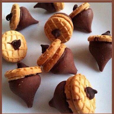 some cookies and pastries are arranged in the shape of star wars characters on a white surface