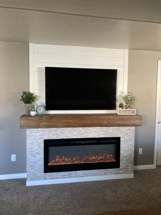 a fireplace with a flat screen tv above it