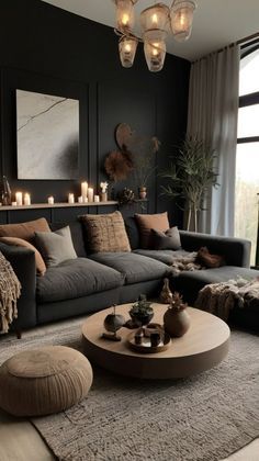 a living room filled with lots of furniture next to a large window covered in candles