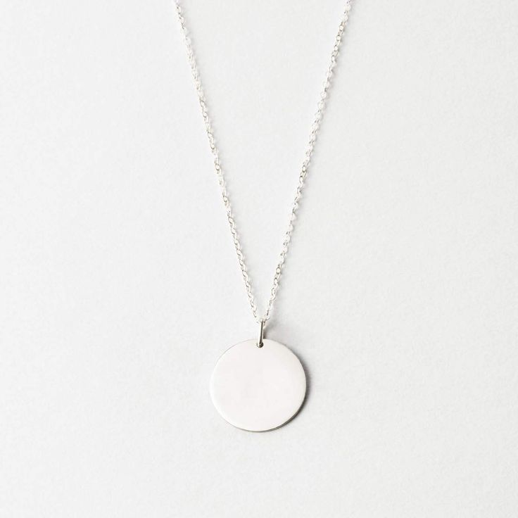 Our 16mm large-sized disk necklace, without personalization. A timeless piece to dress up or down. Classic Everyday Jewelry With Round Pendant, Classic White Gold Charm Necklaces For Everyday, Classic Jewelry With Round Pendant For Everyday, Classic White Gold Charm Necklace For Everyday, Minimalist Round Disc Jewelry With Coin Pendant, Minimalist Everyday Charm Necklace With Coin Pendant, Everyday Minimalist Charm Necklace With Coin Pendant, Everyday Hammered Medallion Jewelry, Minimalist Hammered Pendant Jewelry