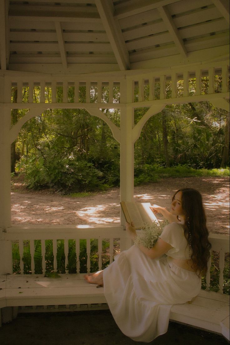 white dress, white gazebo, dreamy photoshoot, fairy, fairy vibes, fairy photoshoot, 70s style white dress, auburn hair, romeo and juliet, academia, reading, book photoshoot, photography ideas. Cottagecore Dress Photoshoot, White Dreamy Dress, Fairy River Photoshoot, Princess Style Photoshoot, Cottagecore Indoor Photoshoot, Desi Senior Pictures, Dreamy Dress Photoshoot, Fairy Like Photoshoot, Cottage Photoshoot Ideas