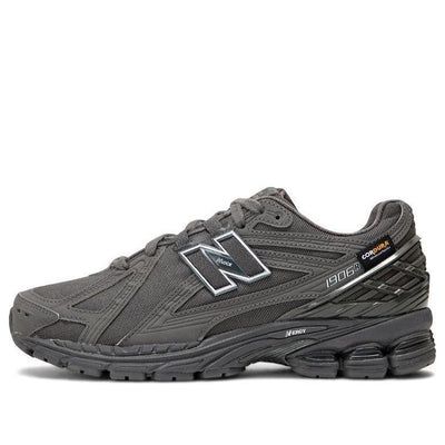 The New Balance 1906R Cordura 'Magnet' is a sleek and stylish sneaker designed for everyday wear. Its rubber sole and Cordura upper provide superior comfort and durability, while its dark gray colorway adds a subtle yet eye-catching touch. The 1906R is perfect for casual outings, outdoor activities, and everything in between. Its unique design is inspired by the classic 1906 silhouette, and its protective toe cap ensures your feet stay safe no matter where your day takes you. With its timeless style and reliable construction, the New Balance 1906R Cordura 'Magnet' is the perfect choice for any active lifestyle. (SNKR/Retro/Unisex/Low Top/Non-Slip/Breathable/Wear-resistant) Gray Sneakers With Vibram Sole And Medium Fit, Gray Sneakers With Vibram Sole Medium Fit, Gray Sneakers With Vibram Sole, Gray Running Shoes With Abzorb Midsole, Gray New Balance Lace-up Sneakers, Gray High-top New Balance Sneakers, New Balance Sneakers With Abzorb Midsole For Errands, Gray Lace-up Sneakers, New Balance Low-top Walking Shoes With Vibram Sole