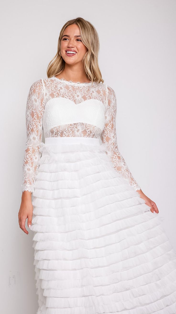 Experience the magic and allure of our Olivia Layered White Lace Tulle Dress, where timeless elegance meets modern romance. Whether you're walking down the aisle, attending a formal event, or celebrating a special occasion, this dress will make you feel like the epitome of grace and beauty. 78747 D8-2 Elegant Lace Dress With Sheer Bodice And Sweetheart Neckline, Elegant Wedding Dress With Lace Trim And Fitted Bodice, Elegant Lace Trim Wedding Dress For Party, Elegant Wedding Dress With Lace Trim For Party, Lace Bodice Fitted Dress For Prom Season, Fitted Lace Dress With Sheer Bodice For Prom, Elegant Lace Dress With Fitted Bodice For Wedding, Elegant Bridesmaid Gown With Illusion Neckline, Prom Season Dresses With Fitted Lace Bodice