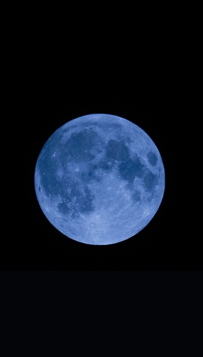 an airplane flying in front of the moon