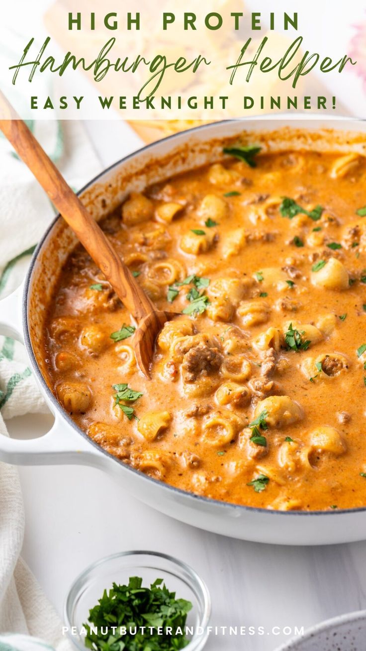 a skillet filled with hamburger helper soup and garnished with parsley