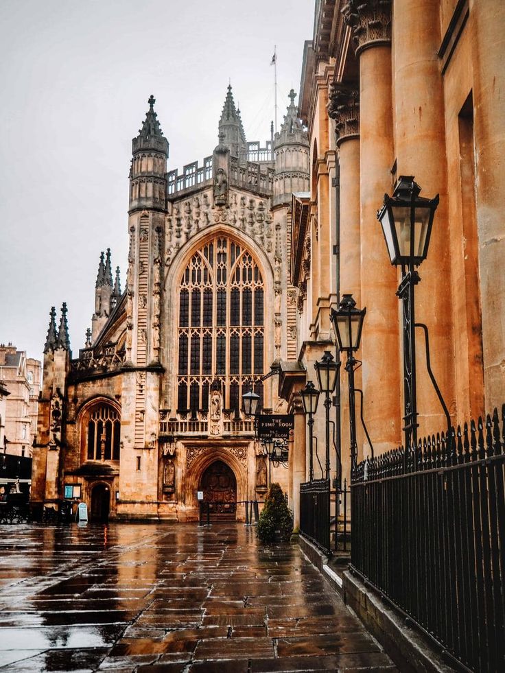 an old building is shown in the rain