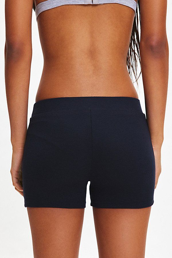 Our new favorite Out From Under short in a micro style. Designed in an ultra-soft & stretchy knit featuring a low-rise elasticated waistband and boxer-inspired detailing. Only at Urban Outfitters. Features Out From Under Syd sleep shortie Knit boxer short Soft and stretchy knit Low-rise elasticated waistband Faux boxer front detailing Slim body-skimming fit Micro length Easy pull-on style UO exclusive Content + Care 97% Viscose, 3% spandex Machine wash Imported Size + Fit Model in Grey is 5’9" and wearing size Small Measurements taken from size Small Waist: 24" Length: 3" | Out From Under Syd Sleep Shortie in Black, Women's at Urban Outfitters Women Men Shoes, Boxer Shorts, Small Waist, Black Fits, New Woman, Low Rise, Womens Bottoms, Fashion Forward, Fitness Models