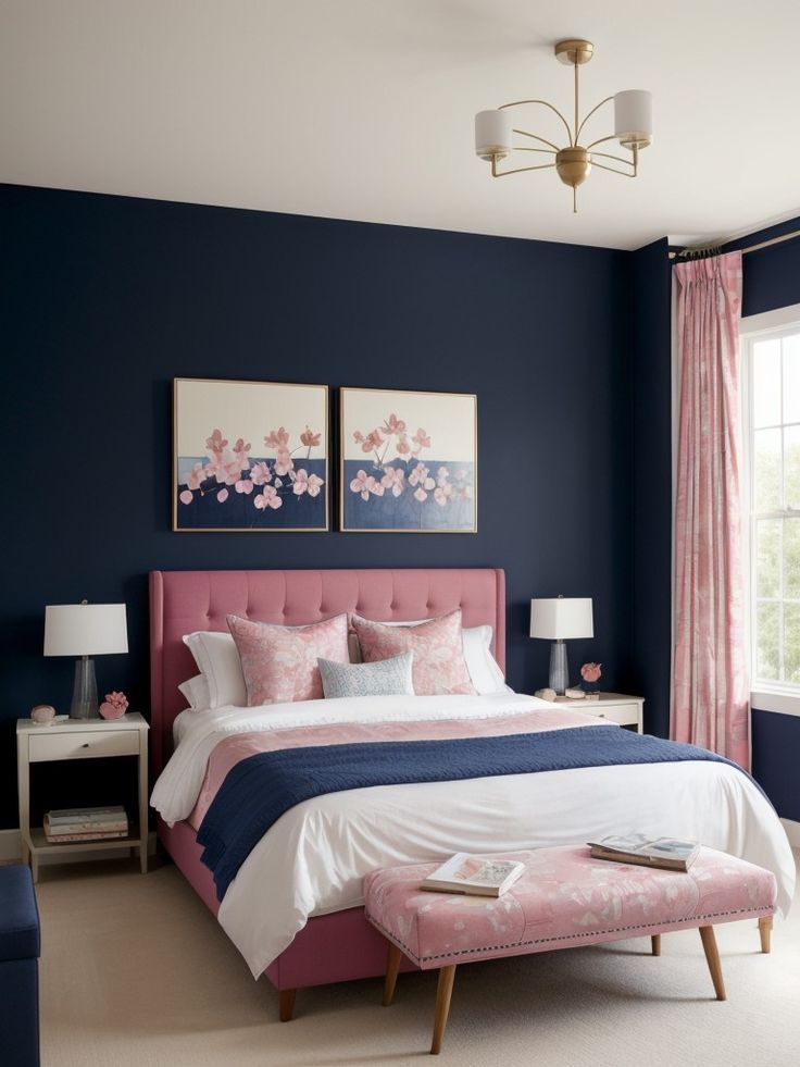 a bedroom with blue walls and pink bedding