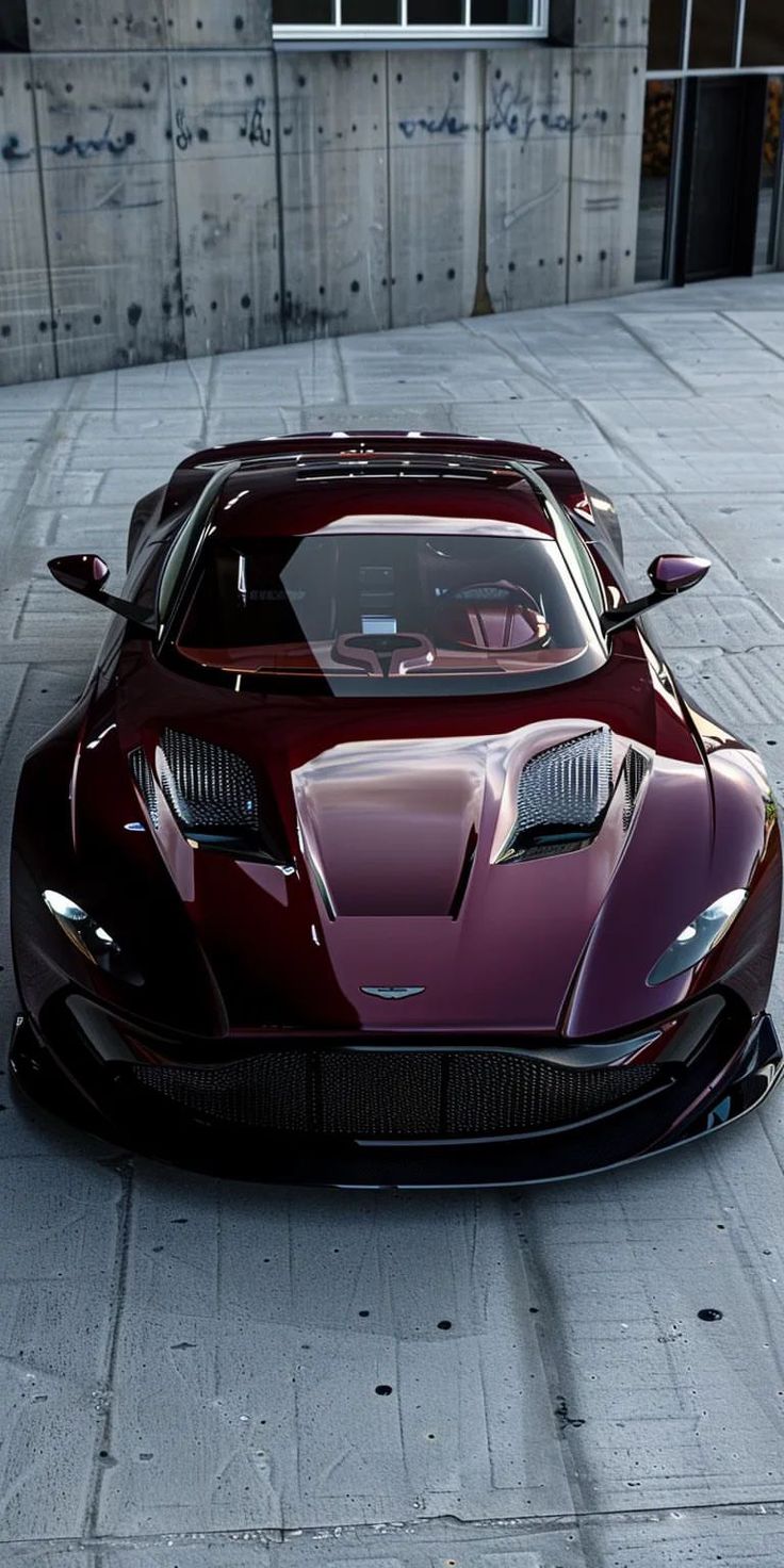 a red sports car parked in front of a building