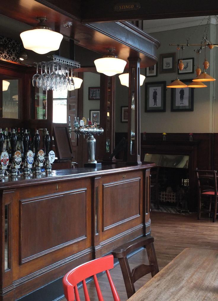 an empty bar with several chairs around it