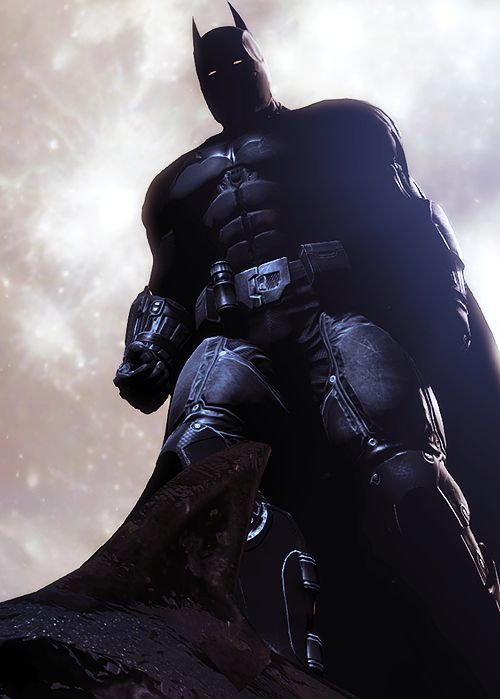 a batman standing on top of a rock