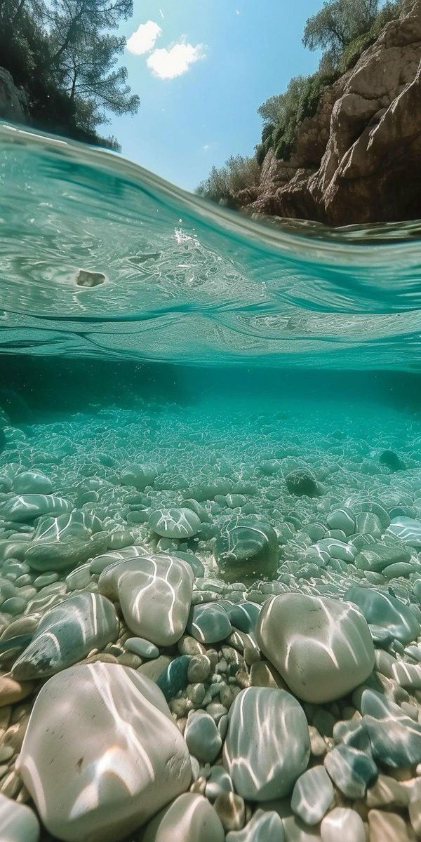 an underwater view of rocks and water