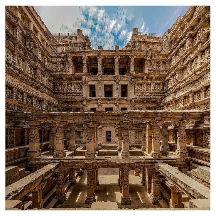 the interior of an ancient building with columns and pillars