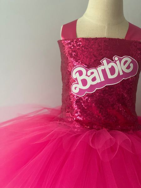 a pink dress with the word barbie on it