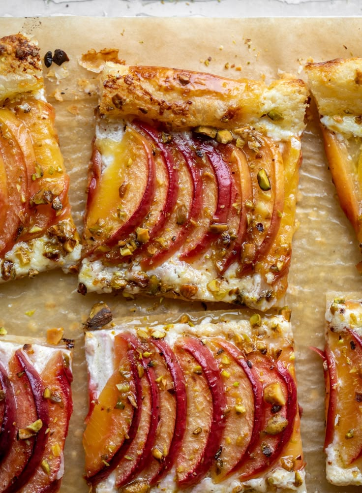 slices of apple and goat cheese pizza on a cutting board