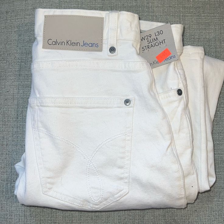 Brand New Men's Calvin Klein Slim Straight White Jeans Zip Fly. New With Tags. Size 29 X 30. White Slim Fit Casual Jeans, Straight White Jeans, Fitted White Calvin Klein Boxer Briefs, Calvin Klein Jeans Mens, Cheap White Men's Jeans, Calvin Klein White T-shirt For Streetwear, White Calvin Klein, Clueless Outfits, Jeans White