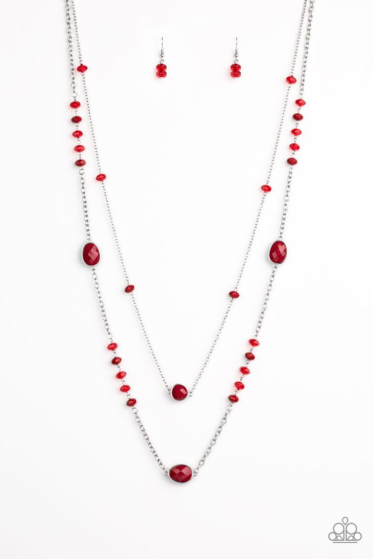 a necklace and earring set with red beads