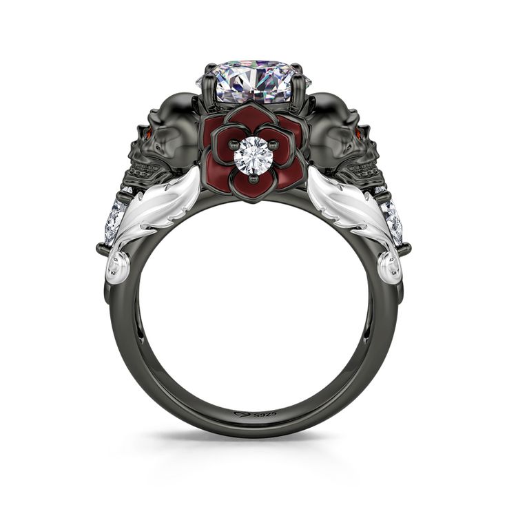 a black and white ring with red flowers on the side, surrounded by three diamonds