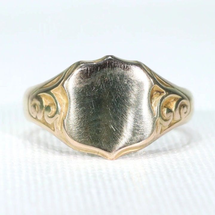 I know class rings are a thing, and I'm in no way opposed, but when the young men in my family graduate from college, I give them a ring just like this one. There is something about a ring like this one that makes young men look, well, manly. Do you know an upcoming graduate? Send him out into the world right, with a bespoke suit, a pair of well made wingtips and a ring like this. This wonderful Edwardian version of the signet ring was hand crafted in Birmingham, England in 1915. The top is a sh Antique Dome Ring Stamped 14k As Gift, Classic Yellow Gold Signet Ring With Maker's Mark, Classic Hallmarked Signet Ring With Round Band, Classic Engraved Promise Ring With Classic Design, Classic Hallmarked Signet Ring For Promise, Classic Hallmarked Signet Promise Ring, Vintage White Gold Signet Ring Stamped 14k, Classic 14k Stamped Signet Ring For Anniversary, Classic Sterling Silver Concave Rings