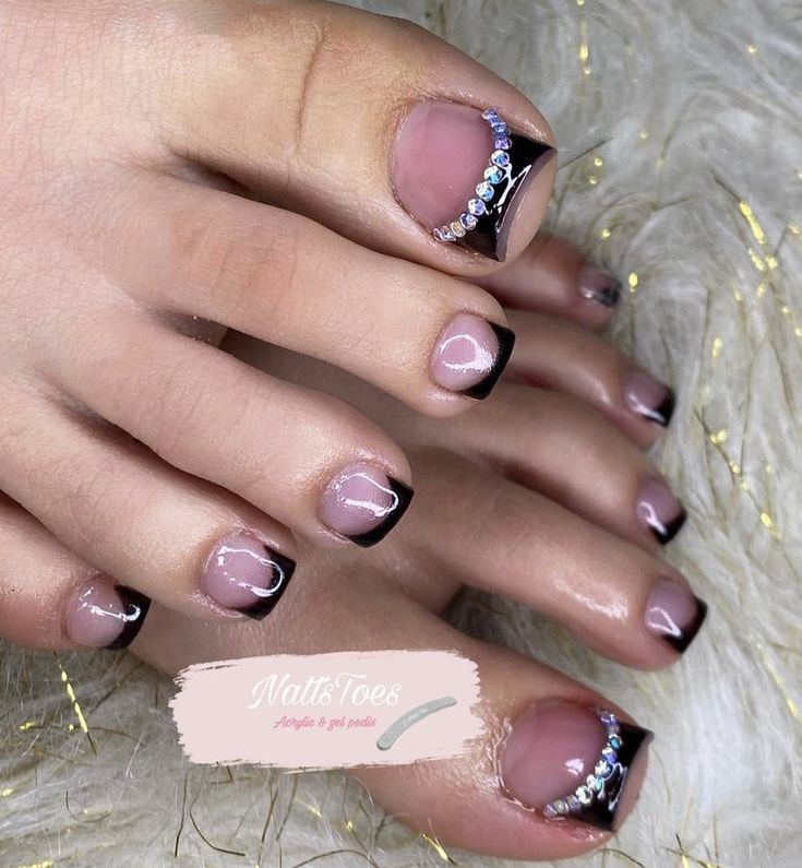 Black Tips Pedicure, Black Toenail Designs With Rhinestones, Black Toe Nails With Rhinestones, Pedicures With Rhinestones, Pedicure Ideas With Gems, Acrylic Toes Black French Tip, Black Toe Designs, Toe Nail Rhinestone Designs, White French Tip Toes With Rhinestones