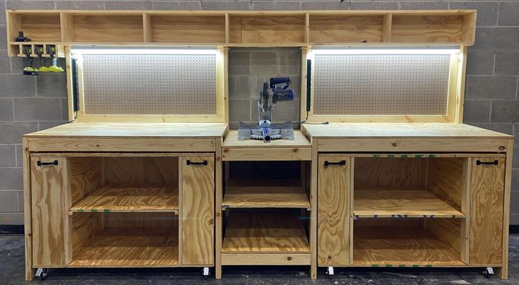 a large wooden cabinet with two doors and shelves on each side, in front of a brick wall