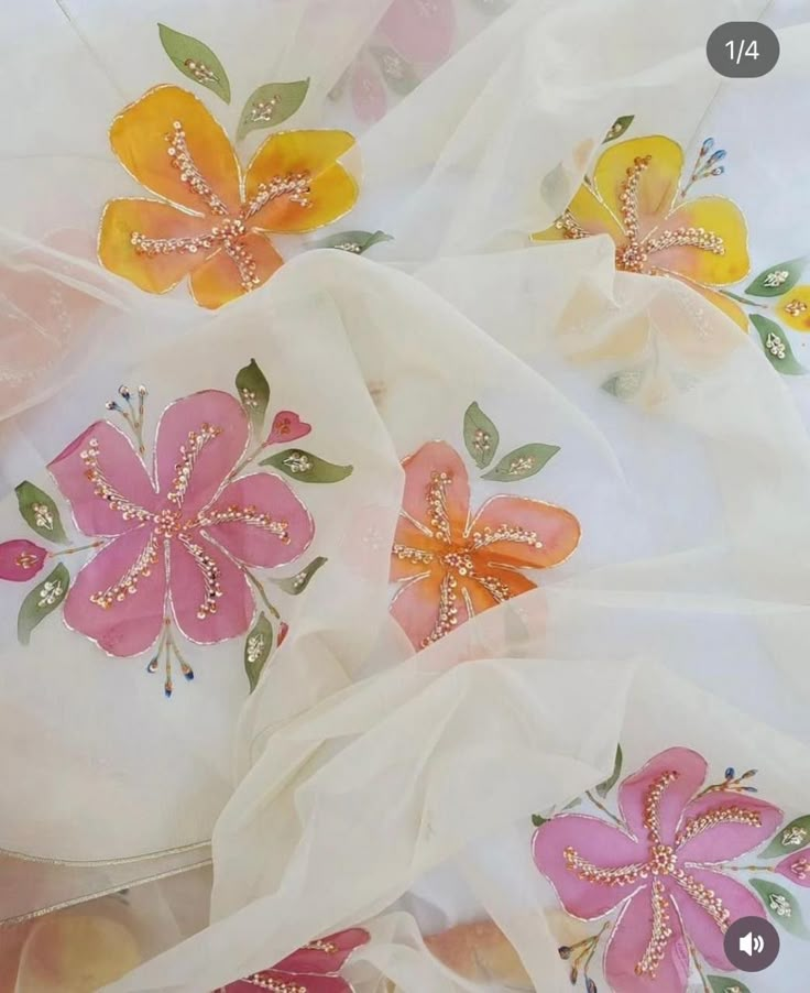 an image of some flowers on white fabric