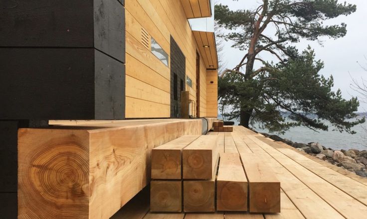 a wooden bench sitting on top of a wooden deck