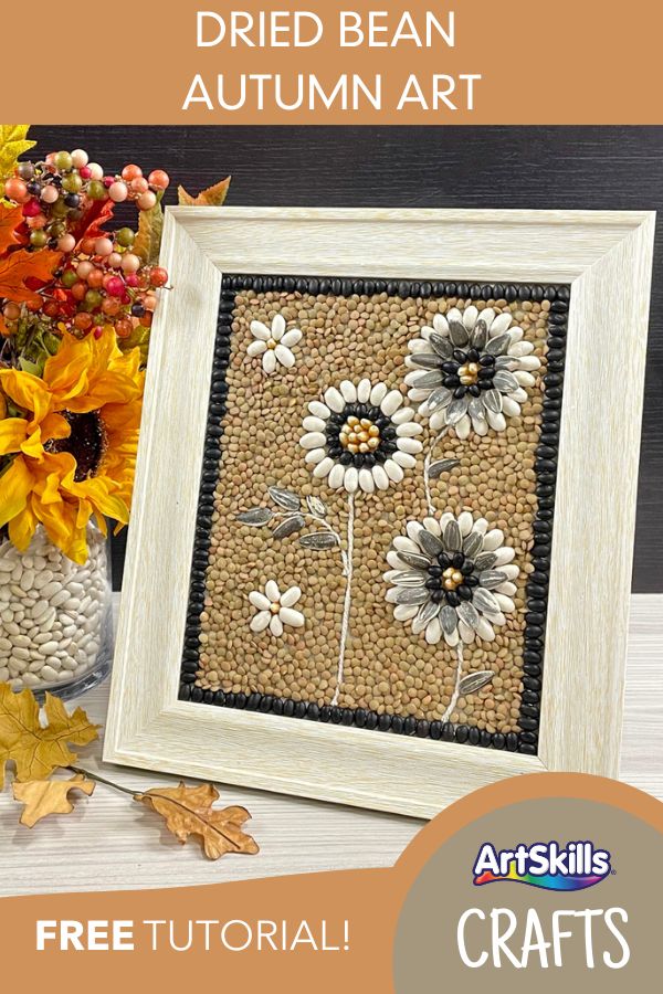 the finished bead autumn art is displayed next to a vase with flowers