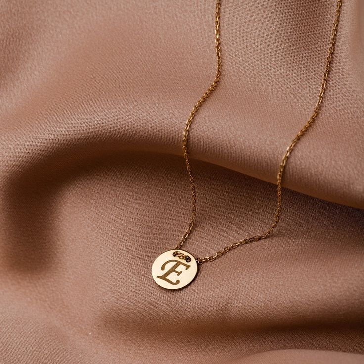 Personalized initial necklace in 14K solid gold or sterling silver 925. Create your custom letter necklace exactly as you want it. Write the monogram of your name or of the name of your beloved. Available in two simple dainty designs, disc and hexagon. The best Valentines day gift. 100% handcrafted with love! PRODUCT DETAILS ● Material: 14K solid gold, 14K white gold, sterling silver 925 ● Hexagon Diameter: 11mm ● Disc Diameter: 11mm ● Length: 16 inches (Please contact if you need a different length) HOW TO ORDER - CUSTOM ORDERS ●Choose from the drop down menus the available options (Material) and leave us a note for any special requirements. ●For special orders forward us pictures and our designer will do the best to meet your expectation.  PRODUCTION TIME - SHIPPING POLICIES ●Please keep Personalized Gold Jewelry, 14k Gold Initial Necklace, Hexagon Necklace, Dainty Initial Necklace, Custom Initial Necklace, Best Valentine's Day Gifts, Gold Necklace Simple, Solid Gold Necklace, Initial Necklace Gold