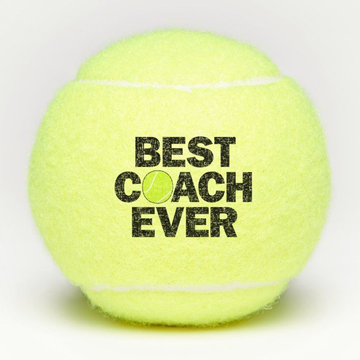 a yellow tennis ball with the words best coach ever on it's back side