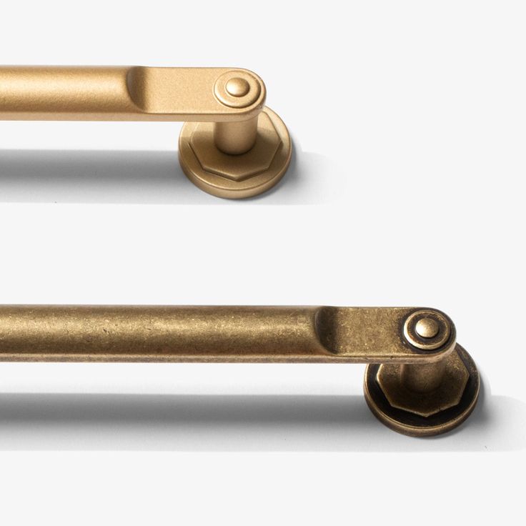 an image of two handles and knobs on a white background with clipping shadows