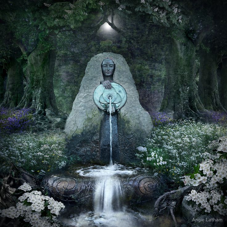 a statue in the middle of a forest with a waterfall coming out of it's center