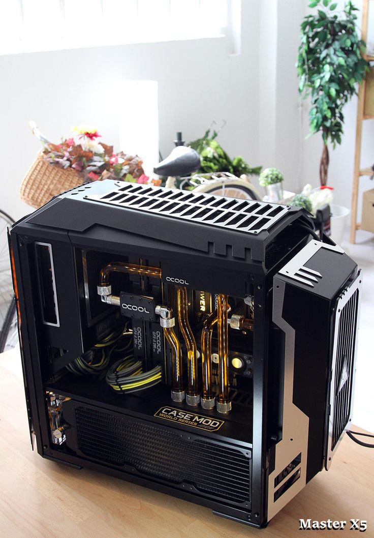 a black computer case sitting on top of a wooden table