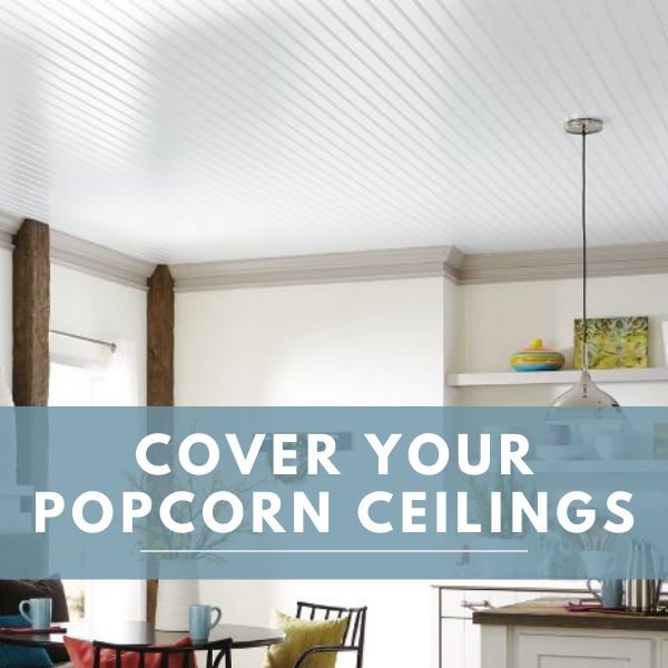 a living room filled with furniture next to a kitchen and dining room table covered in popcorn ceilings