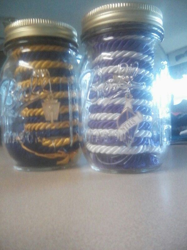 two mason jars filled with different types of wires on a counter top next to each other