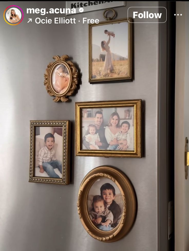 a wall with pictures and frames on it