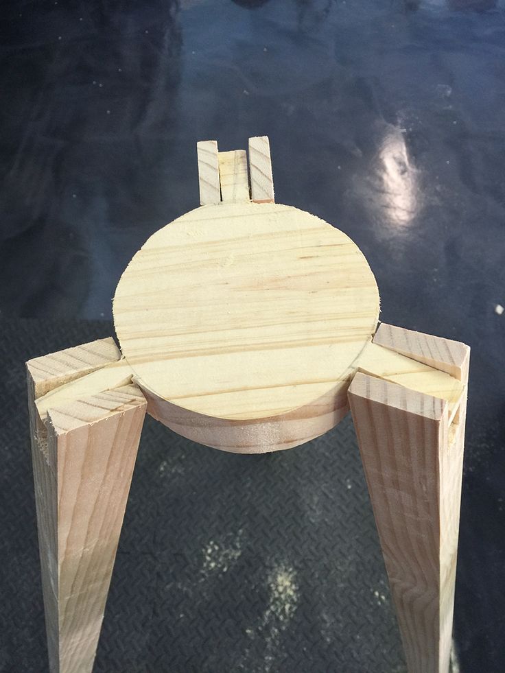 a small wooden table sitting on top of a floor