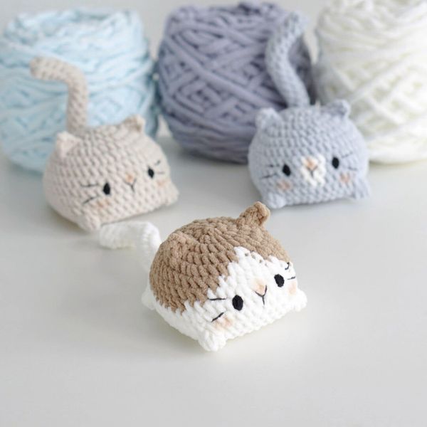 small crocheted animals sitting next to each other