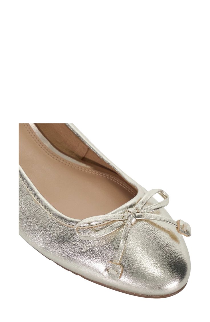 A delicate bow tops the rounded toe of a ballerina-style pump set on a low heel. Leather upper/synthetic lining/rubber sole Imported Elegant Ballet Flats With Round Toe, Elegant Fitted Ballet Flats With Round Toe, Feminine Formal Ballet Flats, Elegant Party Ballet Flats, Formal Court Shoes With Bow And Low Heel, Formal Low Heel Court Shoes With Bow, Elegant Ballet Flats With Removable Insole, Elegant Ballet Flats With Removable Insole And Low Heel, Elegant Low Heel Ballet Flats With Removable Insole