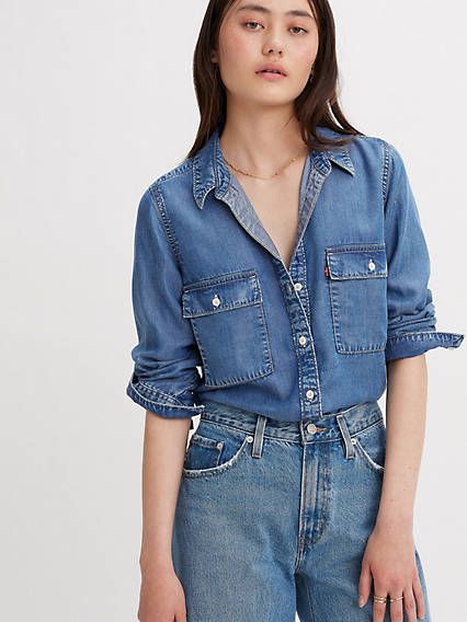 Inspired by classic workwear, our Doreen Utility Shirt features a timeless button-up front, two oversized patch pockets and versatile long sleeves that you can wear rolled up or down. A utilitarian-inspired shirt Cut with a standard fit With a button-up front Features two oversized patch pockets With adjustable long sleeves Levis Jean, Classic Workwear, Western Denim Shirt, Utility Shirt, Denim Blouse, Shirt Blouses Tops, Levis Women, Cut Shirts, Shop Blouses