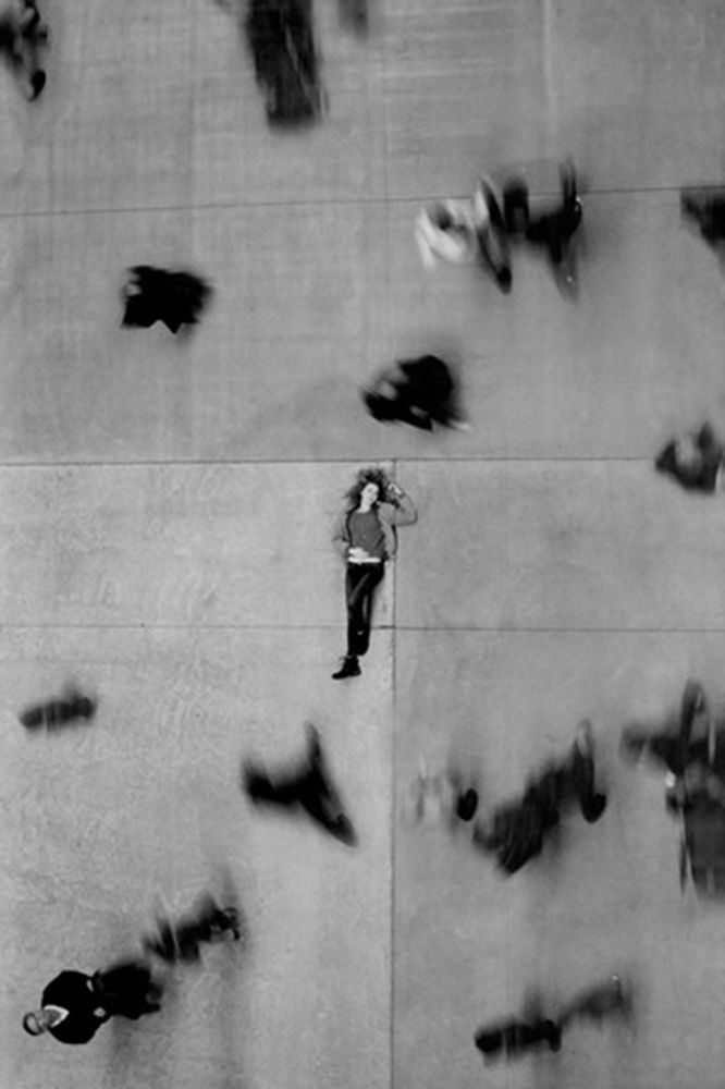 an aerial view of people laying on the ground