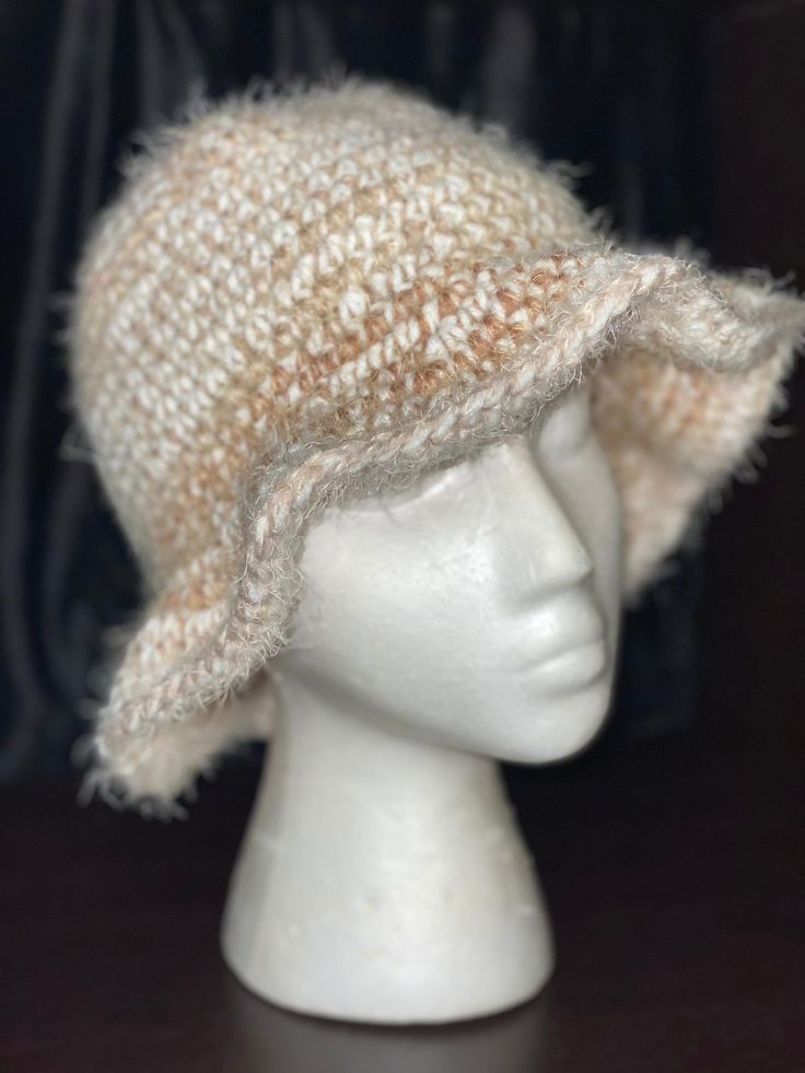 Adult Size Handmade Crochet "Cinnamon Spice" Bucket Hat - a warm and stylish accessory that embodies the cozy vibes of the season.  🌟 Versatile Fashion: Whether you're sipping pumpkin spice lattes at a café or exploring a winter market, our Cinnamon Spice bucket hat adds a touch of boho-chic flair to your look. Pair it with your favorite sweater or coat for a stylish ensemble. 🍁 Embrace the warmth and style of the season with our Handmade Crochet "Cinnamon Spice" Bucket Hat. Elevate your winter fashion game with this cozy and trendy accessory. Treat yourself or surprise someone special - order yours today and enjoy handmade craftsmanship with every wear! Adjustable Beige Crochet Hat For Winter, Beige Yarn Hat For Winter, Bohemian Style Hats For Cold Weather, Casual Cream Crochet Hat For Winter, Handmade Cozy Hat, One Size, Cream Hats For Cold Weather In Fall, Handmade Beige Hat For Fall, Bohemian Knitted Short Brim Hat, Cream Crochet Hat For Winter