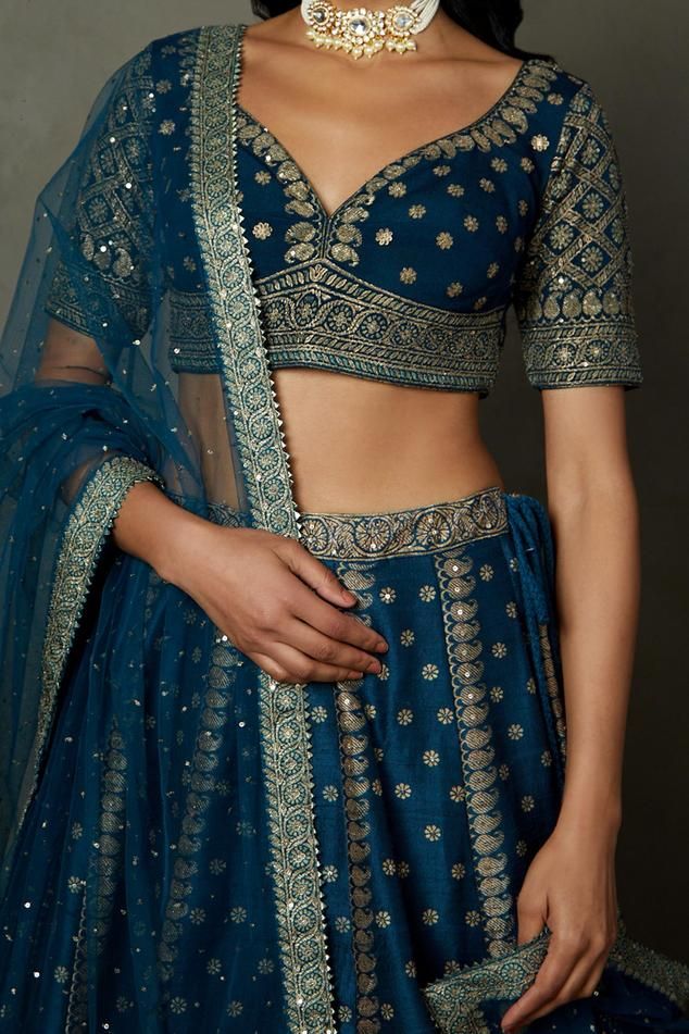 Midnight blue lehenga with all-over paisley prints and aari hand embroidery. Comes with embroidered padded blouse and dupatta.
Components: 3
Pattern: Printed, Hand Embroidered
Type Of Work: Paisley, Aari
Neckline: Leaf
Sleeve Type: Short
Fabric: Silk Dupion
Color: Blue
Other Details: 
Back tassel tie-up
Length:
Blouse: 13 inches
Lehengas: 44 inches
Weight: 1kg
Occasion: Wedding - Aza Fashions Transitional Blue Lehenga With Dupatta, Blue Lehenga With Dupatta, Transitional Season Blue Lehenga With Dupatta, Blue Choli With Dupatta For Transitional Season, Blue Fitted Lehenga For Transitional Season, Transitional Designer Blue Lehenga, Transitional Season Designer Blue Lehenga, Blue Choli For Reception And Transitional Season, Transitional Embroidered Blue Choli