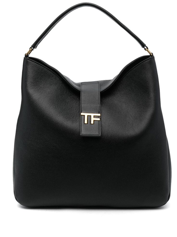 logo-plaque leather tote bag from TOM FORD featuring black, calf leather, grained texture, gold-tone logo plaque, logo stamp to the rear, strap and press-stud fastening, single flat top handle, internal slip pocket and main compartment. Size Info UNI Color Detail Black Made In Italy Material Outer: Calf leather 100% Lining: Polyamide 60% Polyurethane 40% Season One Fall-Winter Season Two Fall-Winter Product bags.. Brand Tom Ford Size And Fit Width 15,75 in / 40 cm Height 14,96 in / 38 cm Depth 3 Everyday Leather Shoulder Bag With Gold-tone Logo, Classic Rectangular Shoulder Bag With Logo Plaque, Leather Bags With Gold-tone Logo Plaque And Double Handle, Leather Bags With Double Handle And Gold-tone Logo, Classic Top Handle Shoulder Bag With Gold-tone Logo Plaque, Black Modern Bag With Gold-tone Logo Plaque, Black Leather Bags With Logo Plaque, Modern Black Bag With Gold-tone Logo Plaque, Chic Business Shoulder Bag With Gold-tone Logo