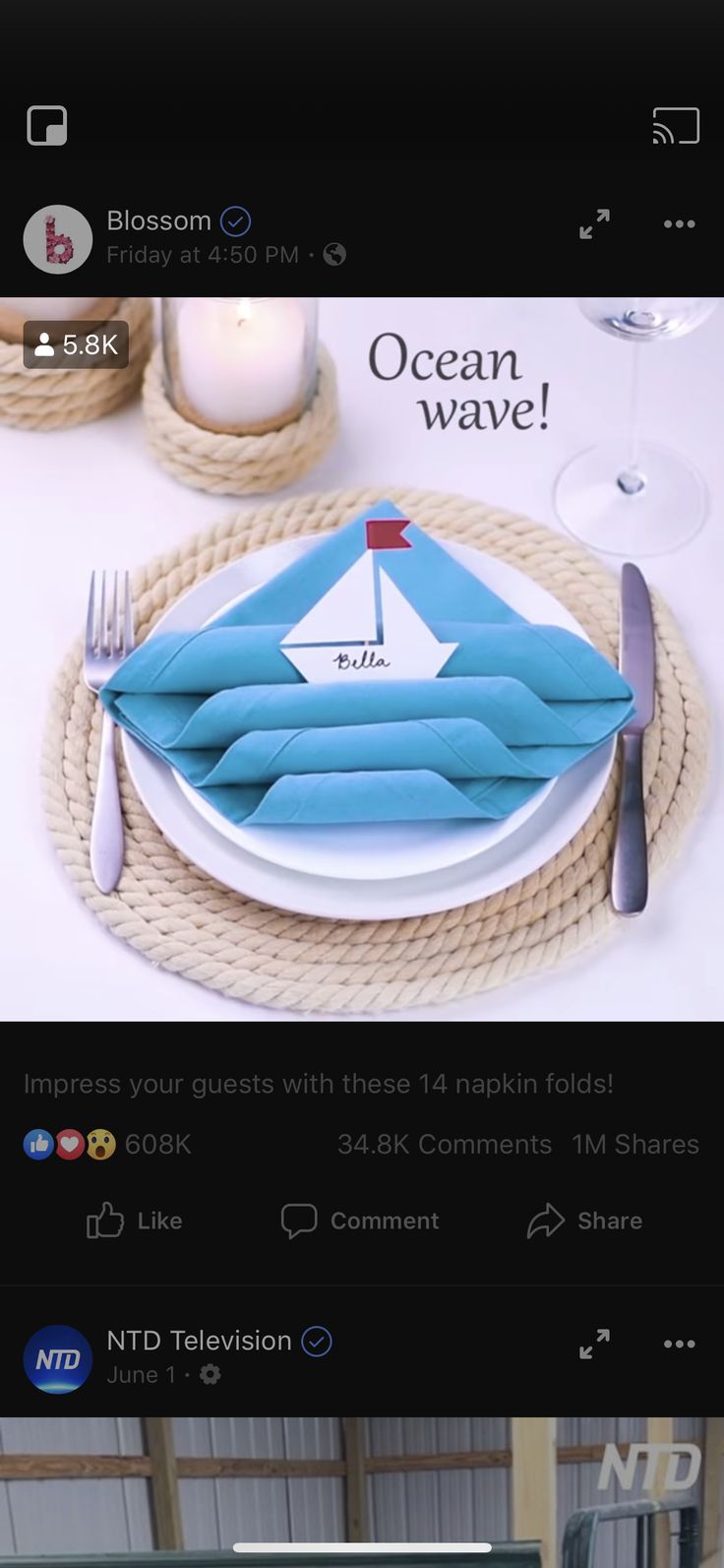 a plate with a sailboat on it is sitting on a table next to a candle