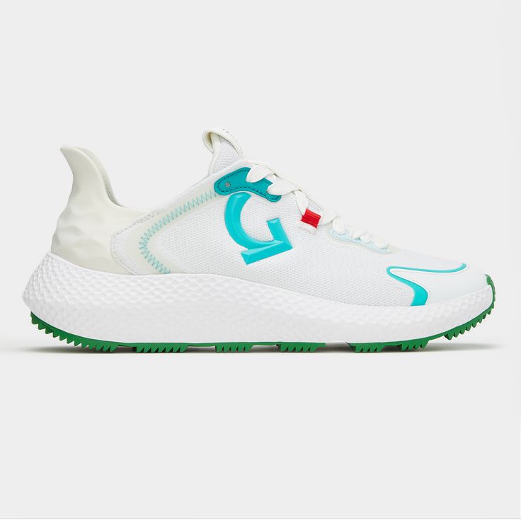 a white sneaker with blue and green accents on the soles, side view