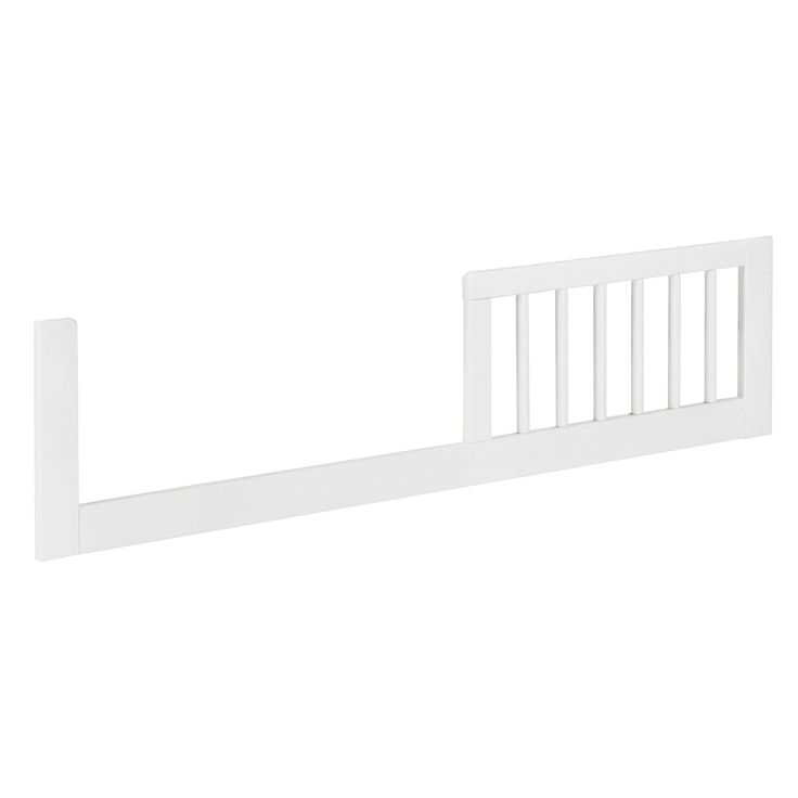 a white baby crib with rails on the top and bottom rail, against a white background