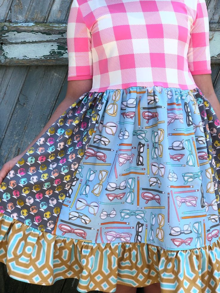 "Put some prep in her step in this extra unique color combination of happy hues. Our School day dress is fashioned in our knit pink/white buffalo plaid 1/3rd sleeve style bodice & a cotton ruffle skirting, perfect for wowing the crowd! Hand designed from a delightful mix of prints that please & soft colors. Great for School events, back to school, School portraits, school day wear, gift giving, & everyday wear! All designs are tagged in the even size. Dress length: 12mo/18mo: 17\" 2/ Fitted Spring School Dresses, Fitted Dresses For School In Spring, Fitted Spring Dresses For School, Preppy Fitted Dresses For School, Playful Fitted Dress For School, Fun Fitted Dress For School, Multicolor Summer Dress For School, Fitted Multicolor Dress For School, Multicolor Fitted Dress For School